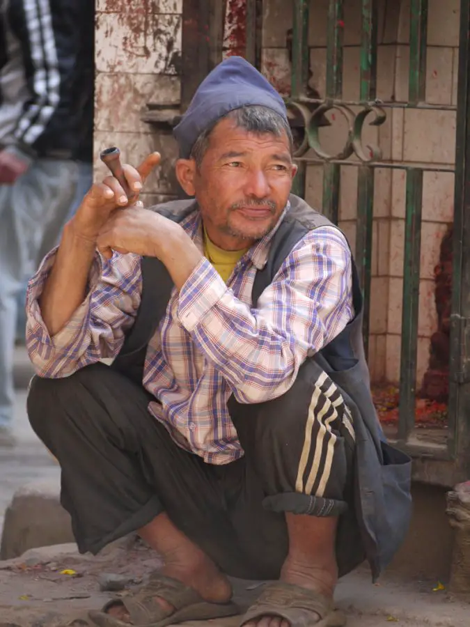Local man smokes a chillum in downtown Kathmandu