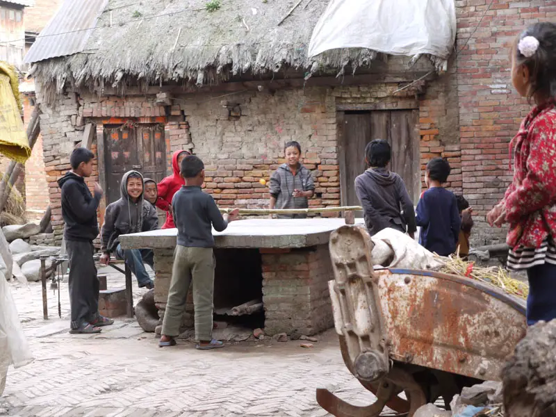 Kids play table tennis in the courtyards of Bhaktapur, Nepal