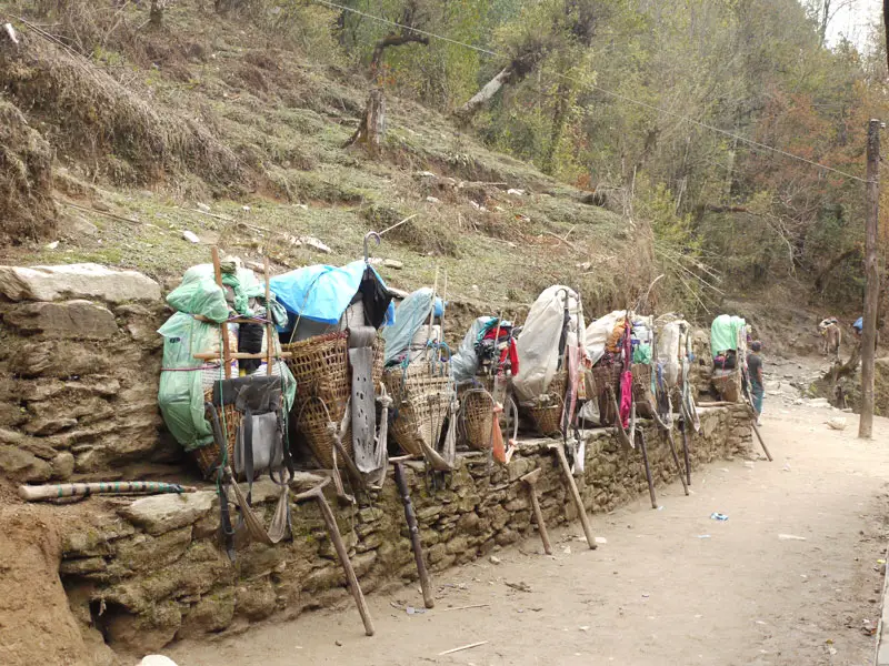 Porters leave their packs down while they stop for lunch en route to Karikhola