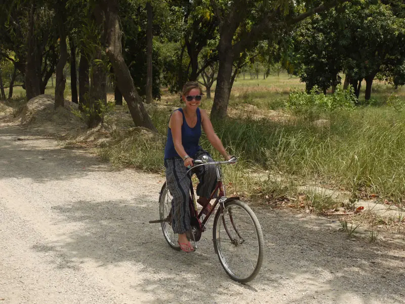 Noelle cycling through the Monastic Zone in Lumbini, Nepal