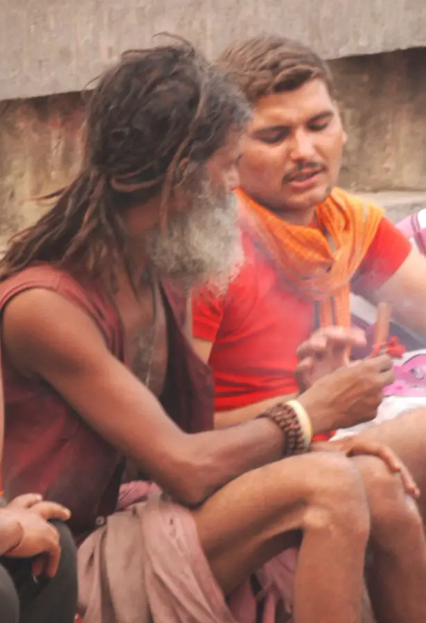 Saddhu and pilgrim sharing a chillum, Haridwar