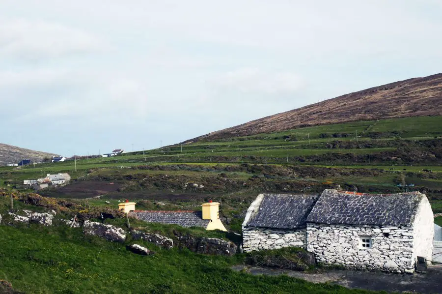 Stone whitewash buildings breaking up the green countryside on Mizen Head, West Cork
