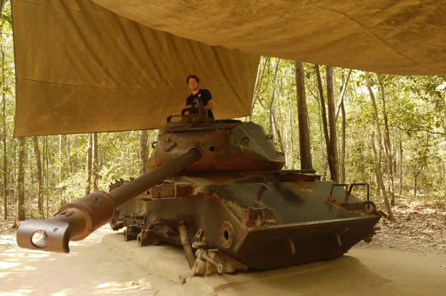 Brian with an old tank that was blown up during the fighting at the Chu Chi Tunnels