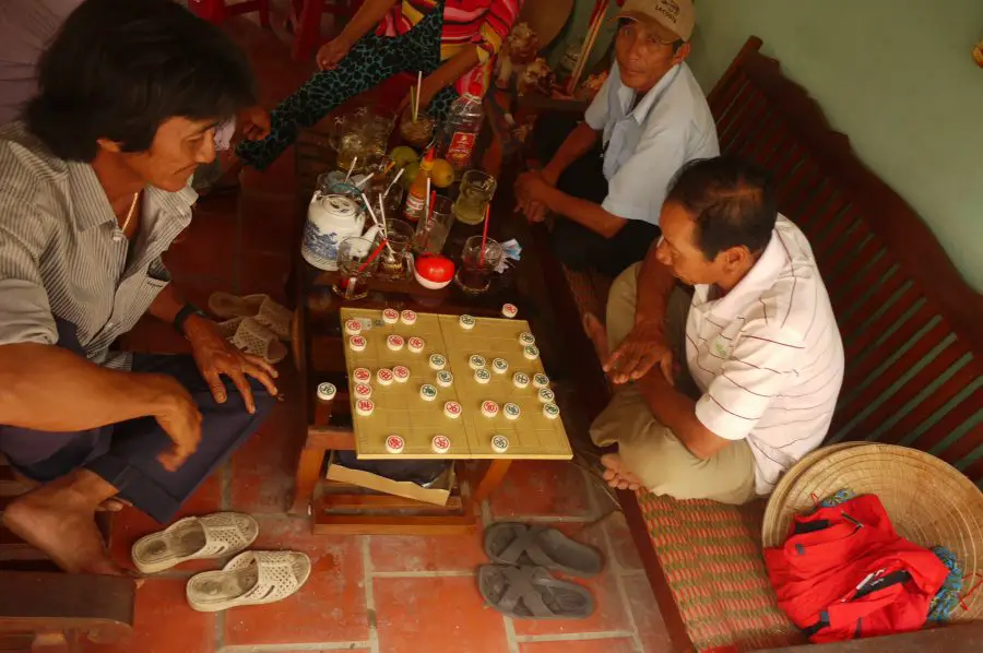 Men playing checkers