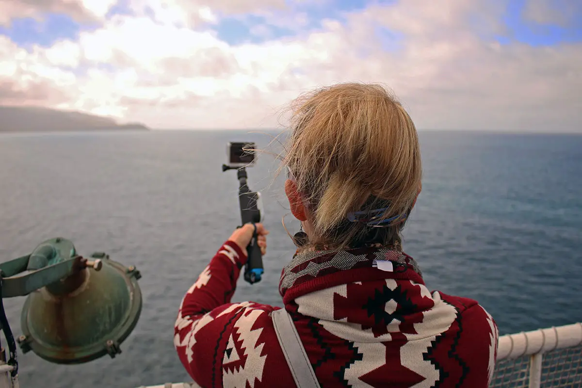 How we afford to travel full-time, Noelle filming with the GoPro