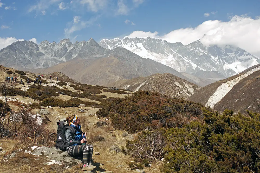 Noelle stopping to take it all in on the Everest Base Camp Trek without a guide 