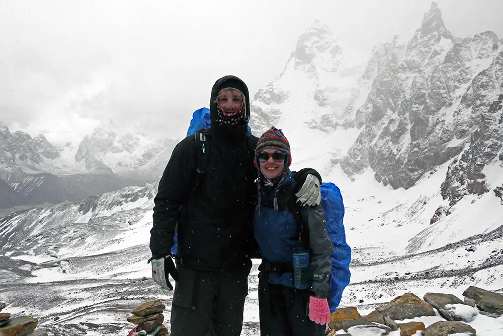 Wrapped up against the elements at the top of the Renjo La Pass on the Everest Base Camp Trek self-guided 
