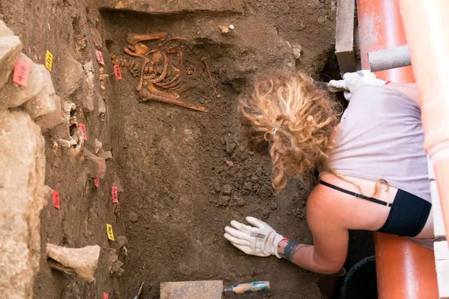 An archaeologist work to excavate more remains under Kutna Hora Bone Church | A day trip from Prague to Kutna Hora Church of bones