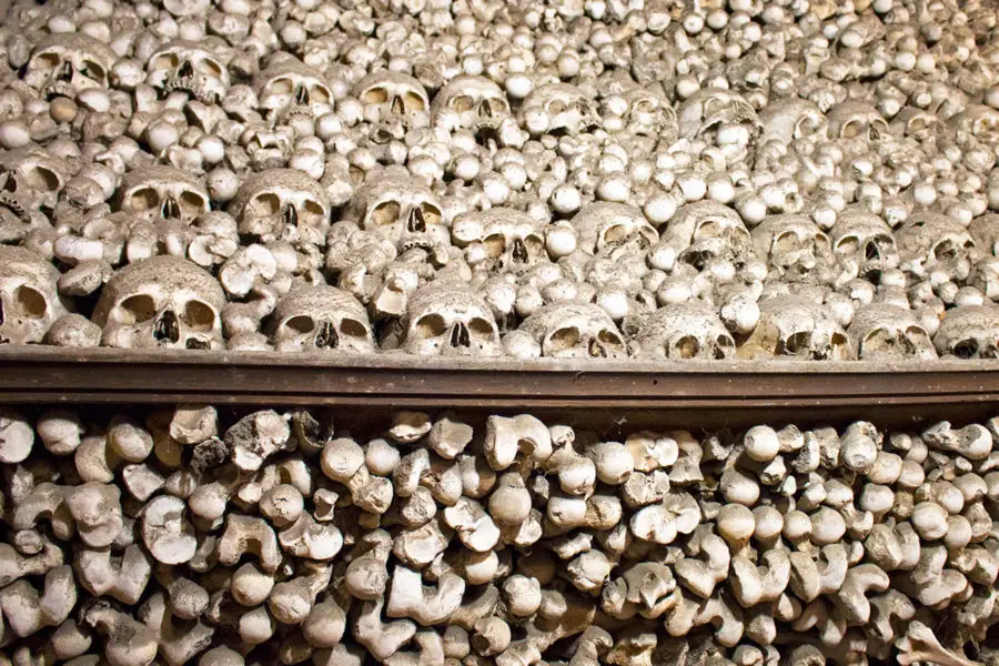 A close-up of one of the huge pyramids of human bones inside Sedlec Ossuary | A day trip from Prague to Kutna Hora bone church